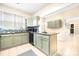 Kitchen with light green cabinets, granite counters, and stainless steel appliances at 3635 Tryon Courthouse Rd, Cherryville, NC 28021