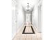 Long hallway with tile floors and neutral-colored walls at 3635 Tryon Courthouse Rd, Cherryville, NC 28021