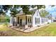 Charming white home with black shutters, front porch, and landscaped yard at 3635 Tryon Courthouse Rd, Cherryville, NC 28021