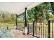 Inviting front porch with wrought iron railing and tiled floor at 3635 Tryon Courthouse Rd, Cherryville, NC 28021