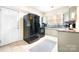 Kitchen features light green cabinets, granite countertops, and a black refrigerator at 3635 Tryon Courthouse Rd, Cherryville, NC 28021