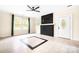 Living room with ceiling fan, fireplace, and tile floors at 3635 Tryon Courthouse Rd, Cherryville, NC 28021