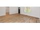 Light filled living room with light brown vinyl plank flooring at 106 Pinecrest Dr, Shelby, NC 28152