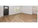 Spacious living room featuring light brown vinyl plank flooring and an open floor plan at 106 Pinecrest Dr, Shelby, NC 28152