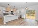 Modern kitchen with white cabinets, stainless steel appliances, and quartz countertops at 106 Pinecrest Dr, Shelby, NC 28152