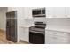 Stainless steel appliances and white shaker cabinets in kitchen at 106 Pinecrest Dr, Shelby, NC 28152