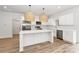 Modern kitchen with white cabinets, stainless steel appliances, and quartz countertops at 106 Pinecrest Dr, Shelby, NC 28152
