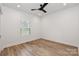 Bright bedroom with ceiling fan and large window, offering natural light at 106 Pinecrest Dr, Shelby, NC 28152