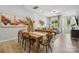 Open dining area with a wood table and chairs, adjacent to a kitchen and living room at 1186 Lost Cove Rd, Indian Land, SC 29707