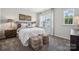 Cozy bedroom with a queen-size bed and neutral decor at 1186 Lost Cove Rd, Indian Land, SC 29707