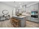 Modern kitchen with gray cabinets, quartz countertops, and island at 1186 Lost Cove Rd, Indian Land, SC 29707