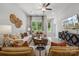 Spacious living room with a seating area centered around a geometric coffee table at 1186 Lost Cove Rd, Indian Land, SC 29707
