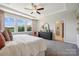 Main bedroom with trey ceiling, large windows, and ensuite bath at 1186 Lost Cove Rd, Indian Land, SC 29707