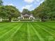 Luxury home exterior with manicured lawn at 3531 Sharon Rd, Charlotte, NC 28211