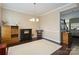 Dining room with hardwood floors, fireplace, and ample natural light at 4812 Weber Ct, Gastonia, NC 28056