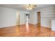 Living room with hardwood floors and views of bathroom and kitchen at 5692 Lee Cline Rd, Conover, NC 28613