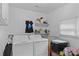 Laundry room with washer, dryer, and shelving for storage at 627 Brevard St, Statesville, NC 28677