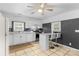 Kitchen boasts white cabinets, granite countertops, and a breakfast bar at 627 Brevard St, Statesville, NC 28677