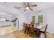 Bright dining room with hardwood floors and view into the kitchen at 627 Brevard St, Statesville, NC 28677