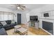 Comfortable living room with hardwood floors and fireplace at 627 Brevard St, Statesville, NC 28677