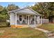 Cozy bungalow with front porch and well maintained yard at 627 Brevard St, Statesville, NC 28677