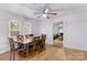 Dining room with hardwood floors and a wooden table with six chairs at 627 Brevard St, Statesville, NC 28677