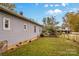 Side view of house with yard and fence at 627 Brevard St, Statesville, NC 28677