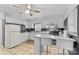 White kitchen with granite countertops, stainless steel appliances, and breakfast bar at 627 Brevard St, Statesville, NC 28677