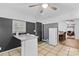 Kitchen has white cabinets, granite countertops and a breakfast bar with seating at 627 Brevard St, Statesville, NC 28677