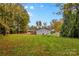 Spacious backyard with mature trees and shed at 627 Brevard St, Statesville, NC 28677