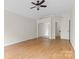 Spacious bedroom with hardwood floors and mirrored closet doors at 6400 Whitewater Dr, Charlotte, NC 28214