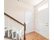 Bright foyer with hardwood floors, staircase, and interior door at 9510 Birkwood Ct, Charlotte, NC 28278