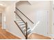 Elegant staircase with dark wood and white balusters at 9510 Birkwood Ct, Charlotte, NC 28278