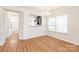 Open dining area with hardwood floors and view of kitchen at 9510 Birkwood Ct, Charlotte, NC 28278
