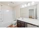 Clean bathroom with a tub, toilet and dark vanity at 9510 Birkwood Ct, Charlotte, NC 28278