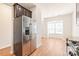 Kitchen with stainless steel refrigerator and view into dining area at 9510 Birkwood Ct, Charlotte, NC 28278