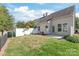 Private backyard with grassy area and a fence at 9510 Birkwood Ct, Charlotte, NC 28278