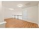 Spacious loft area with hardwood floors and access to hallway at 9510 Birkwood Ct, Charlotte, NC 28278