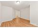 Well-lit bedroom with wood-look flooring and neutral walls at 9510 Birkwood Ct, Charlotte, NC 28278