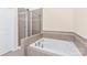 Bathroom with shower and bathtub, tile surround at 9510 Birkwood Ct, Charlotte, NC 28278