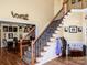 Elegant staircase with iron balusters leading to upper level at 102 Elmhurst Ln, Mooresville, NC 28115