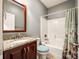 Clean bathroom with granite countertop vanity and shower/tub combo at 1326 Moonshadow Ln, Shelby, NC 28150