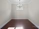 Simple dining room with hardwood floors and a chandelier at 164 Flat Rock Dr, Denver, NC 28037