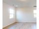 Bright bedroom with hardwood floors and two windows at 2082 Van Buren Rd, Sherrills Ford, NC 28673