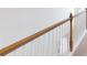 Wooden staircase with white spindles and wooden handrail at 2082 Van Buren Rd, Sherrills Ford, NC 28673