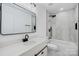 Modern bathroom with white tile, bathtub, and black fixtures at 3419 Taylorsville Hwy, Statesville, NC 28625