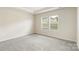 Comfortable bedroom with carpeted floors and neutral walls at 6217 Barcelona Way, Charlotte, NC 28214