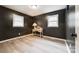 Bright bedroom with hardwood floors and a built-in desk at 7 Moore St, York, SC 29745