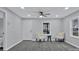 Bright living room featuring gray walls and wood-look floors at 113 Dellinger Rd, Shelby, NC 28152