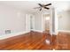 Large bedroom with hardwood floors and access to a bathroom at 1411 Lineberger Ave, Gastonia, NC 28052